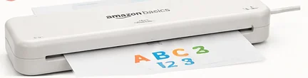 Amazon Basics 9-inch thermal laminator with a laminated alphabet and number card